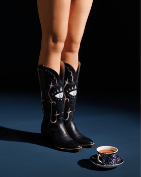 woman standing in cowboy boots